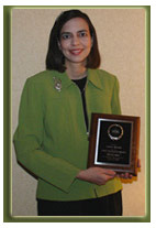 Ms. Garrett holding AMEA award.